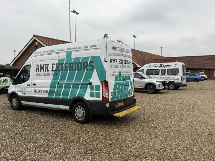 AMK Exteriors van parked at a Norfolk property during a cleaning job